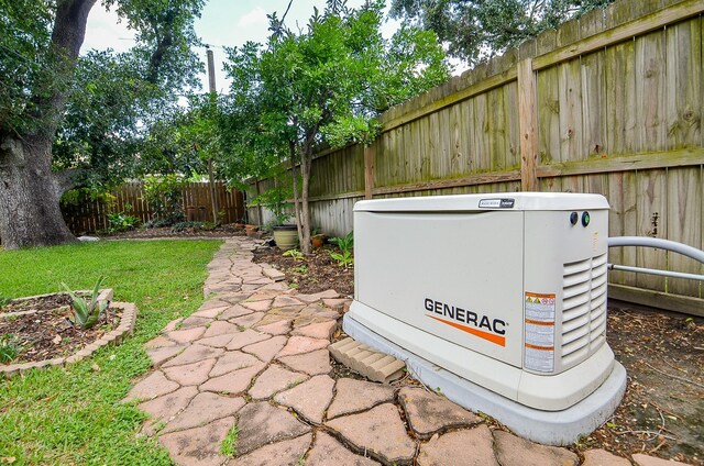 exterior view of a power unit and a fenced backyard