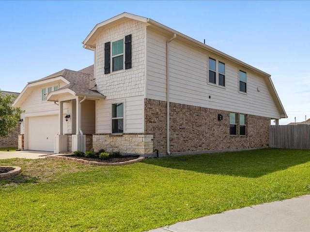 exterior space with a garage, a front lawn, fence, brick siding, and concrete driveway