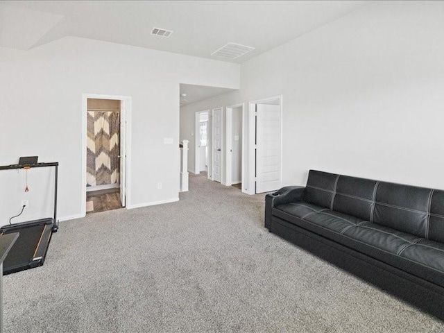 living room featuring carpet floors, baseboards, and visible vents