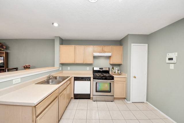 kitchen featuring white dishwasher, gas stove, a sink, light brown cabinets, and under cabinet range hood