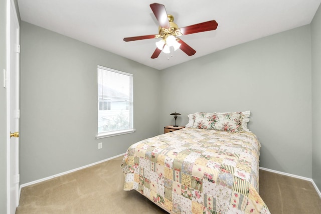 carpeted bedroom with baseboards and ceiling fan