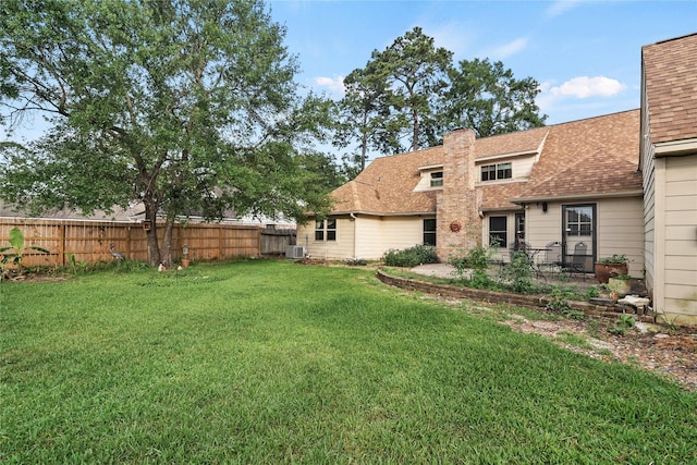 view of yard with fence and cooling unit