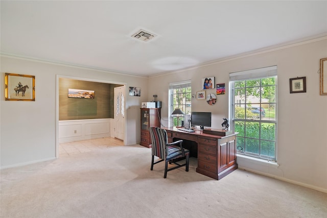 office featuring visible vents, ornamental molding, and light carpet