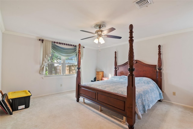 carpeted bedroom with baseboards, ornamental molding, a ceiling fan, and visible vents