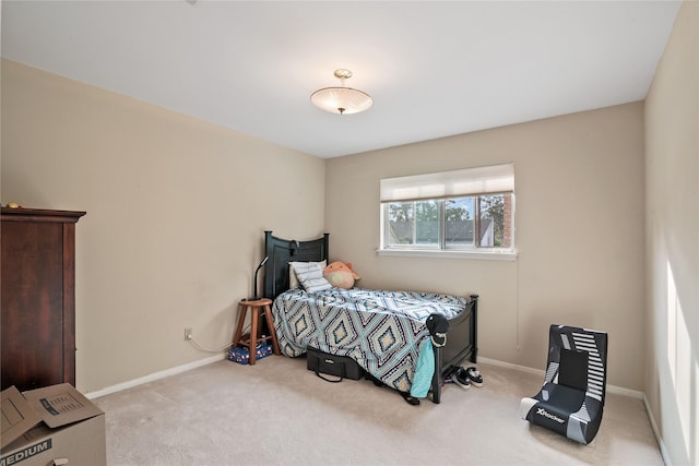 bedroom featuring carpet floors and baseboards