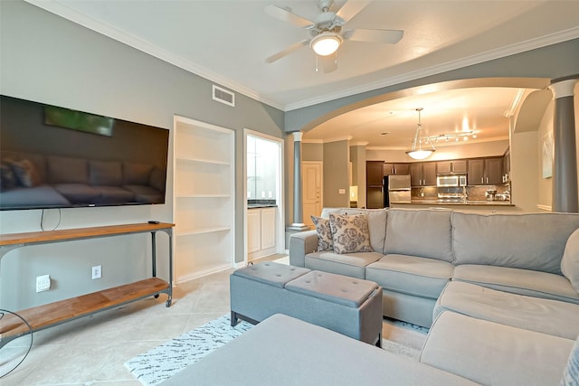 2111 Welch St Unit B117, Houston, TX 77019 - living room with visible vents, a ceiling fan, ornamental molding, ornate columns, and arched walkways