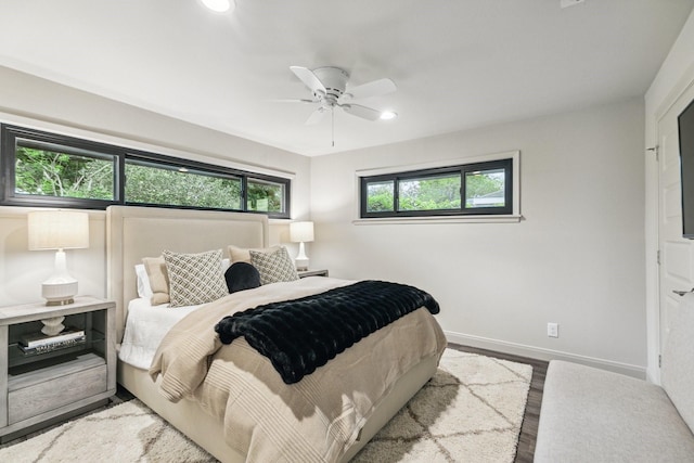 bedroom featuring baseboards, recessed lighting, a ceiling fan, and wood finished floors