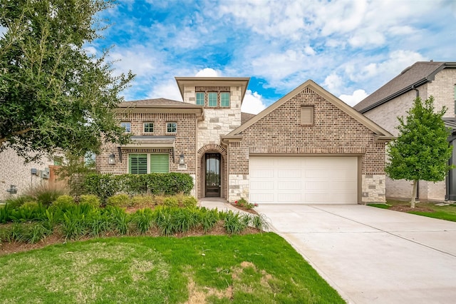 view of front facade featuring brick siding, driveway, stone siding, and a garage