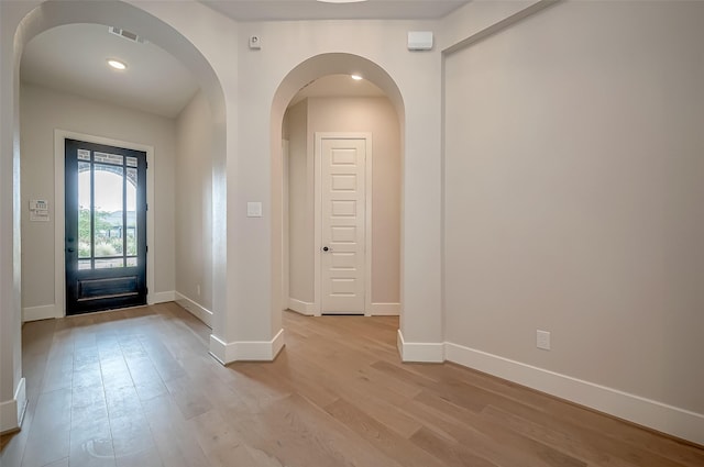 entryway featuring recessed lighting, baseboards, light wood-type flooring, and visible vents