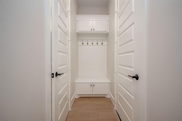 mudroom with light wood finished floors