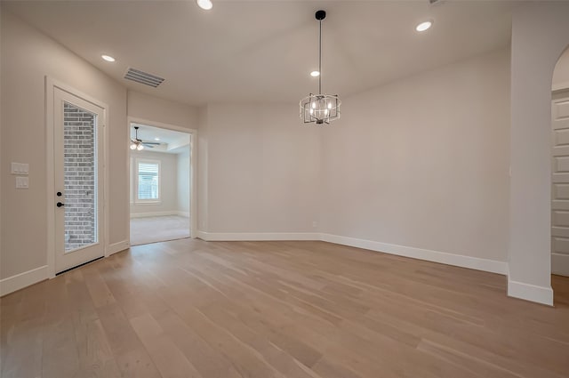 interior space featuring visible vents, light wood-style flooring, and baseboards