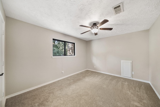 302 Tall Pines Dr, Magnolia, TX 77354 - unfurnished room featuring ceiling fan, a textured ceiling, carpet, baseboards, and visible vents