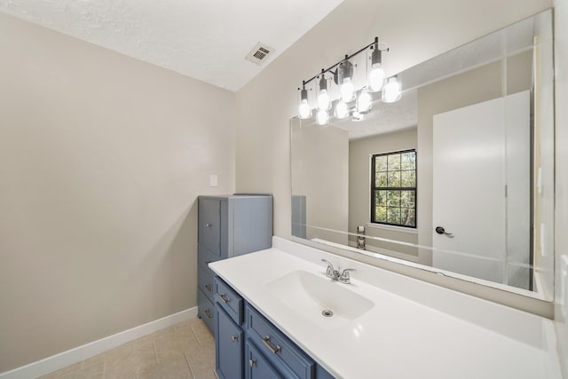 302 Tall Pines Dr, Magnolia, TX 77354 - bathroom featuring visible vents, baseboards, tile patterned flooring, and vanity
