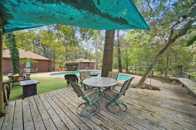 302 Tall Pines Dr, Magnolia, TX 77354 - wooden terrace featuring an outdoor structure, fence private yard, outdoor dining area, an outdoor pool, and a yard
