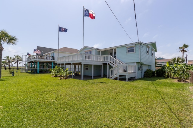 16717 Captain Hook, Jamaica Beach, TX 77554 - rear view of house featuring a yard, a deck, fence, and stairs