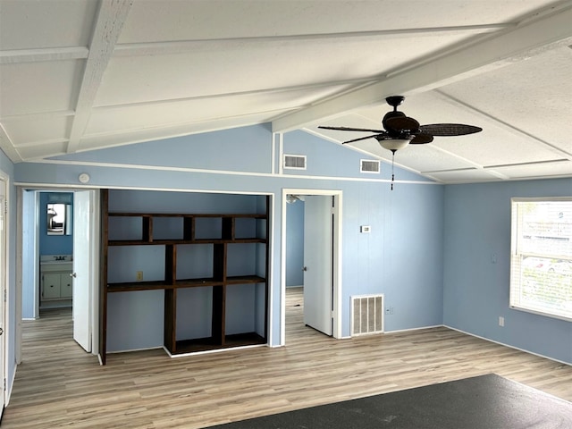 16717 Captain Hook, Jamaica Beach, TX 77554 - unfurnished room with visible vents, lofted ceiling with beams, and wood finished floors