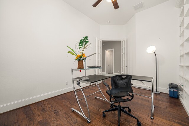 office space featuring baseboards, a ceiling fan, and wood finished floors