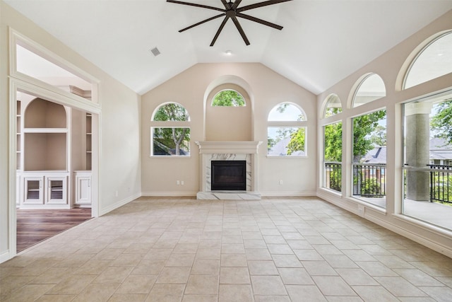 11 Twin Greens Ct, Houston, TX 77339 - unfurnished living room featuring a ceiling fan, visible vents, light tile patterned flooring, built in features, and a high end fireplace