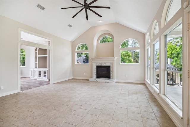 11 Twin Greens Ct, Houston, TX 77339 - unfurnished living room with a ceiling fan, baseboards, a premium fireplace, and visible vents