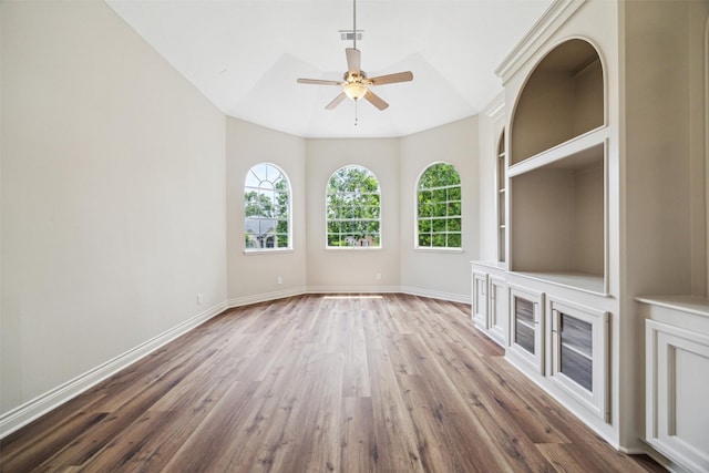 11 Twin Greens Ct, Houston, TX 77339 - unfurnished living room with lofted ceiling, wood finished floors, visible vents, a ceiling fan, and baseboards