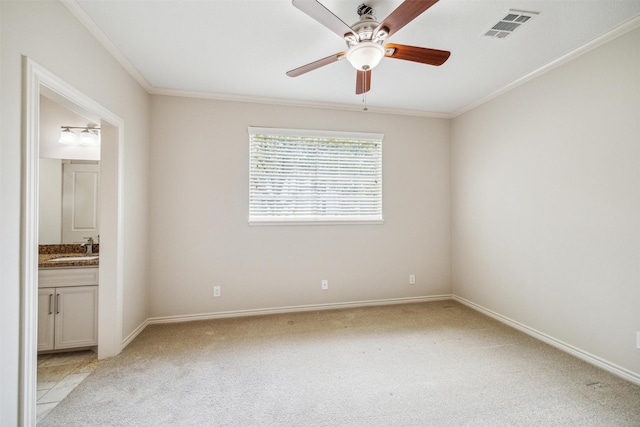 11 Twin Greens Ct, Houston, TX 77339 - unfurnished bedroom with baseboards, visible vents, a sink, crown molding, and light carpet