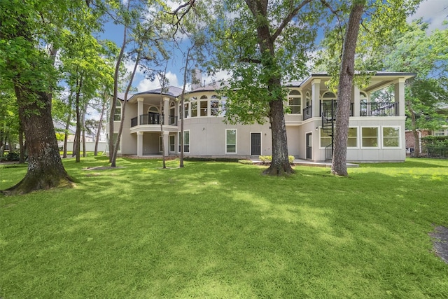 11 Twin Greens Ct, Houston, TX 77339 - rear view of property with a balcony, a yard, stairway, and stucco siding
