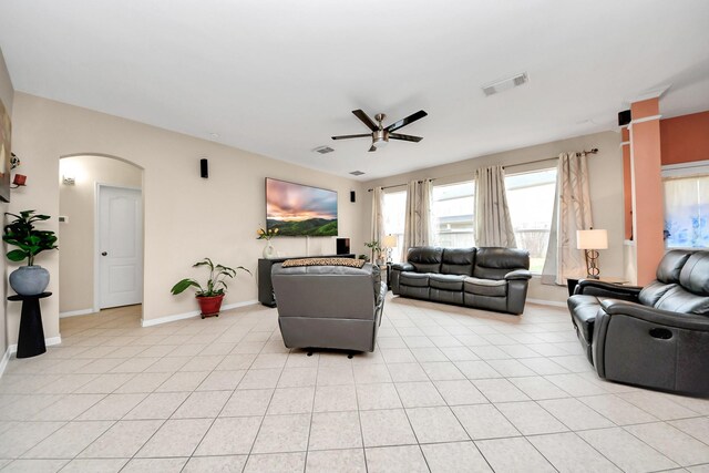 20115 Sunflower Chase Dr, Katy, TX 77449 - living room with ceiling fan, arched walkways, baseboards, and plenty of natural light