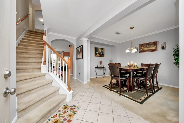 20115 Sunflower Chase Dr, Katy, TX 77449 - dining space featuring light colored carpet, arched walkways, stairway, baseboards, and light tile patterned floors