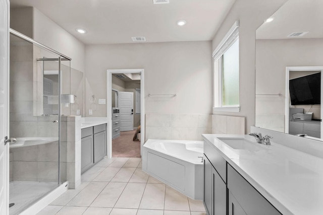 full bath featuring visible vents, a bath, a shower stall, tile patterned flooring, and vanity