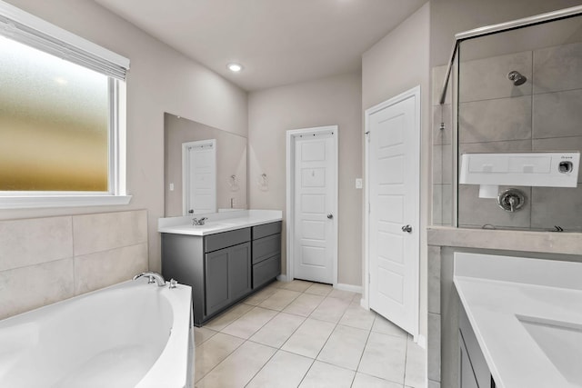 full bath featuring a shower, tile patterned flooring, vanity, and a bath