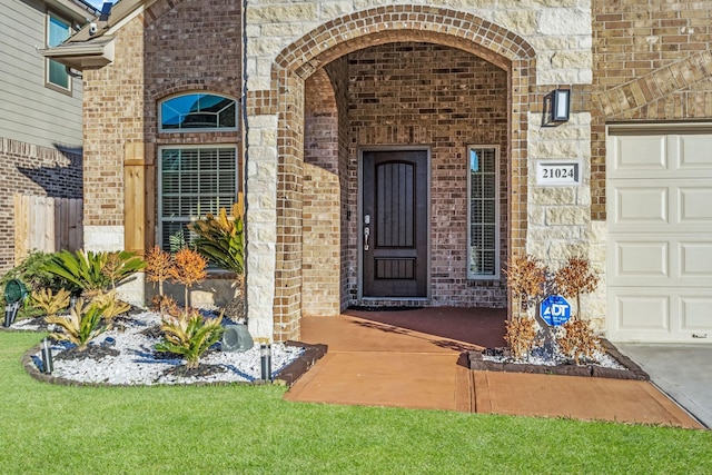 21024 Bracer St, Kingwood, TX 77339 - entrance to property with brick siding and a garage