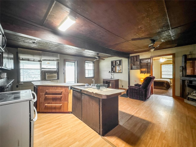 6710 County Road 203, Liverpool, TX 77577 - kitchen featuring white electric range, light wood-style flooring, open floor plan, and a ceiling fan