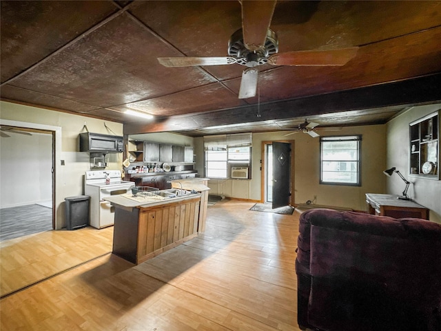 6710 County Road 203, Liverpool, TX 77577 - kitchen featuring a ceiling fan, cooling unit, open shelves, electric stove, and light wood-type flooring