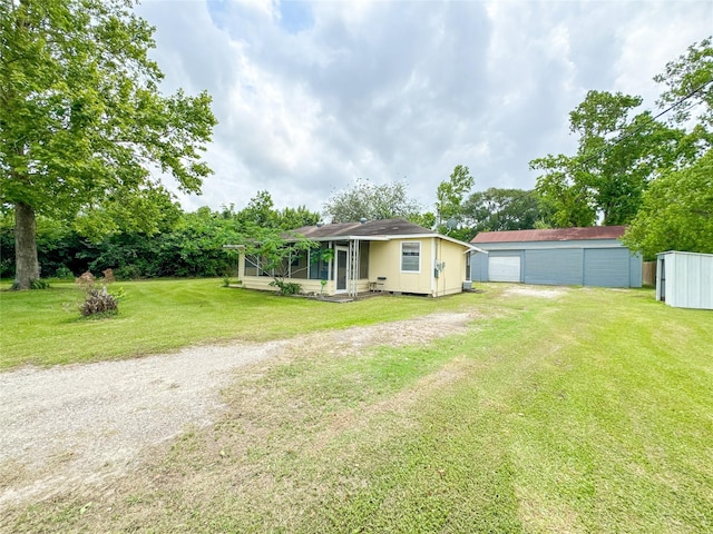 6710 County Road 203, Liverpool, TX 77577 - view of yard with an outdoor structure and a detached garage