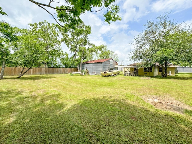 6710 County Road 203, Liverpool, TX 77577 - view of yard with an outdoor structure and fence