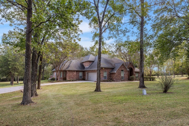 20111 Hilltop Ranch Dr, Montgomery, TX 77316 - traditional-style house with a front lawn, driveway, brick siding, and an attached garage