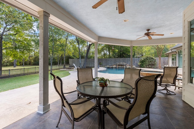 20111 Hilltop Ranch Dr, Montgomery, TX 77316 - view of patio / terrace with outdoor dining space, a fenced backyard, a fenced in pool, and a ceiling fan