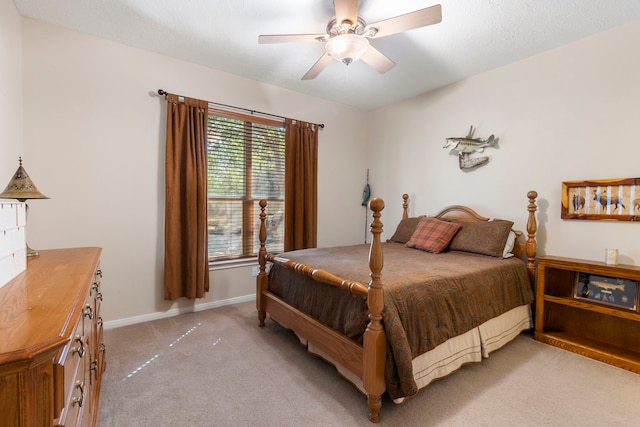 20111 Hilltop Ranch Dr, Montgomery, TX 77316 - bedroom with light carpet, baseboards, and a ceiling fan