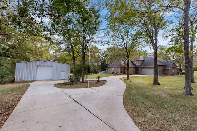 20111 Hilltop Ranch Dr, Montgomery, TX 77316 - view of yard with concrete driveway, an outbuilding, and a detached garage