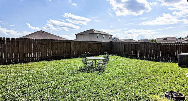 view of yard featuring central AC