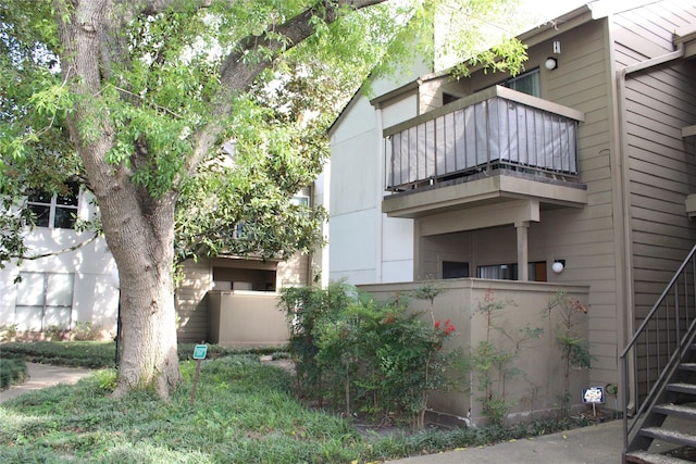 10047 Westpark Dr Unit 70, Houston, TX 77042 - view of property with stairway and fence