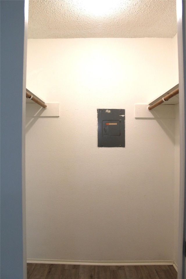 10047 Westpark Dr Unit 70, Houston, TX 77042 - spacious closet with electric panel and dark wood finished floors