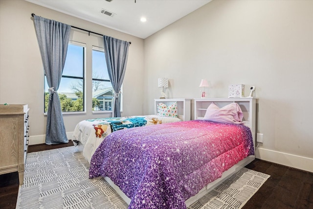 bedroom featuring baseboards, recessed lighting, visible vents, and wood finished floors