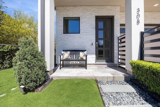 308 Willard, Houston, TX 77006 - property entrance featuring stone siding and a yard