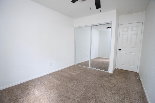 unfurnished bedroom with carpet floors, a closet, baseboards, and visible vents