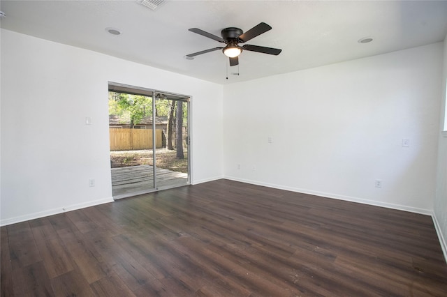 unfurnished room with dark wood-style flooring, baseboards, and a ceiling fan