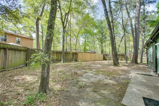 view of yard with a fenced backyard