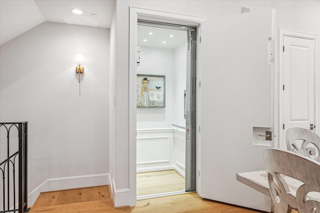 interior space with wood finished floors and recessed lighting