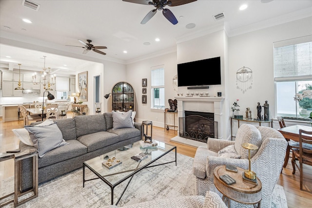823 Blackshire Ln, Houston, TX 77055 - living room featuring a ceiling fan, visible vents, and light wood-style floors
