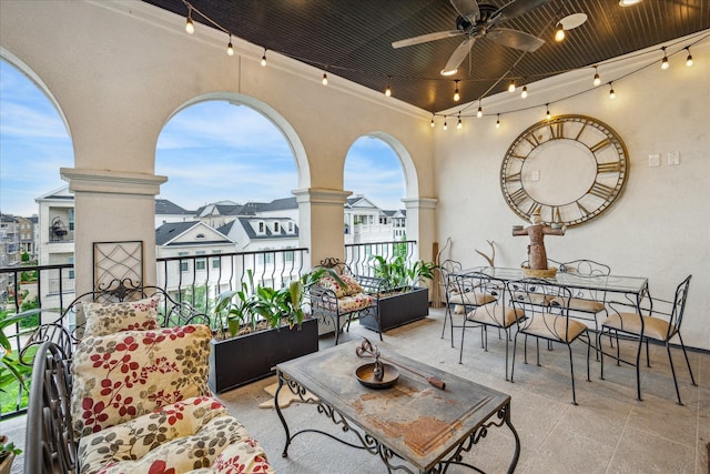 balcony with a ceiling fan and outdoor dining area